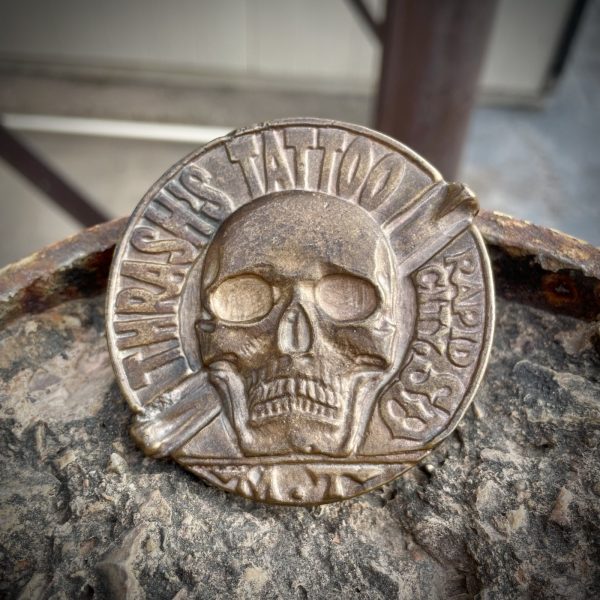 Thrash’s Tattoo bronze belt buckle by Matt Thrash